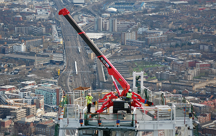 Unic spider crane scaling the Shard.